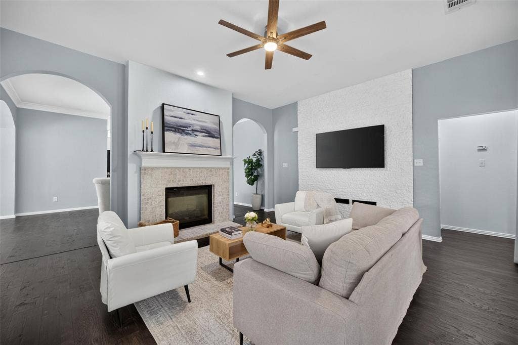 1102 Hartman Court, Arlington, TX 76006 Wood-finish flooring, recessed lighting, and a ceiling fan with integrated light