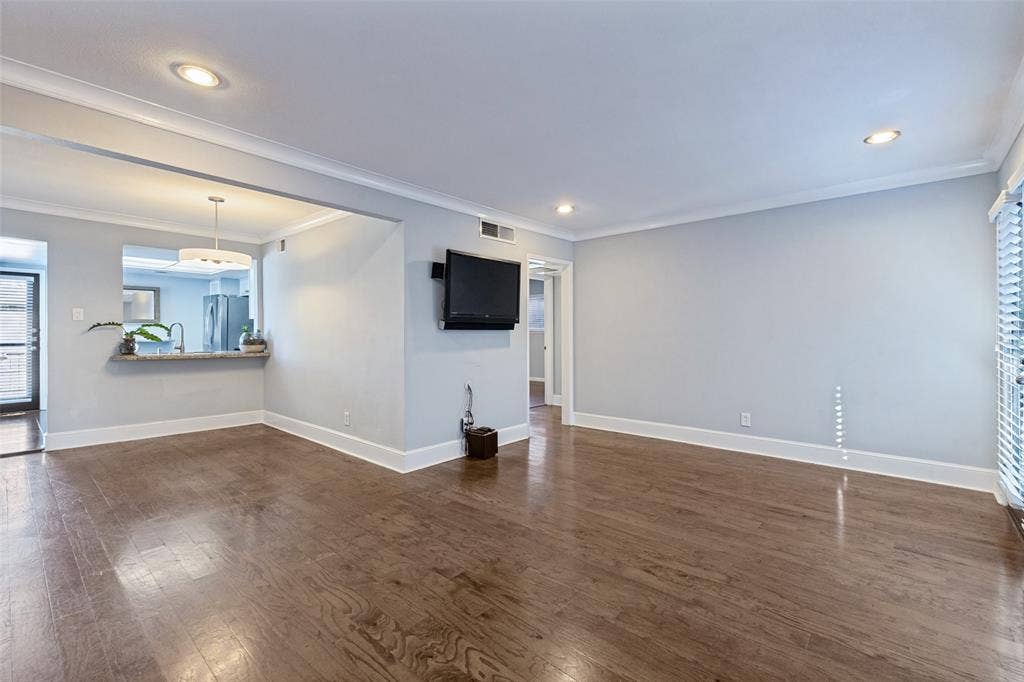 10207 Regal Oaks Drive, #210, Dallas, TX 75230 Wood-finish flooring, recessed lighting, and crown molding