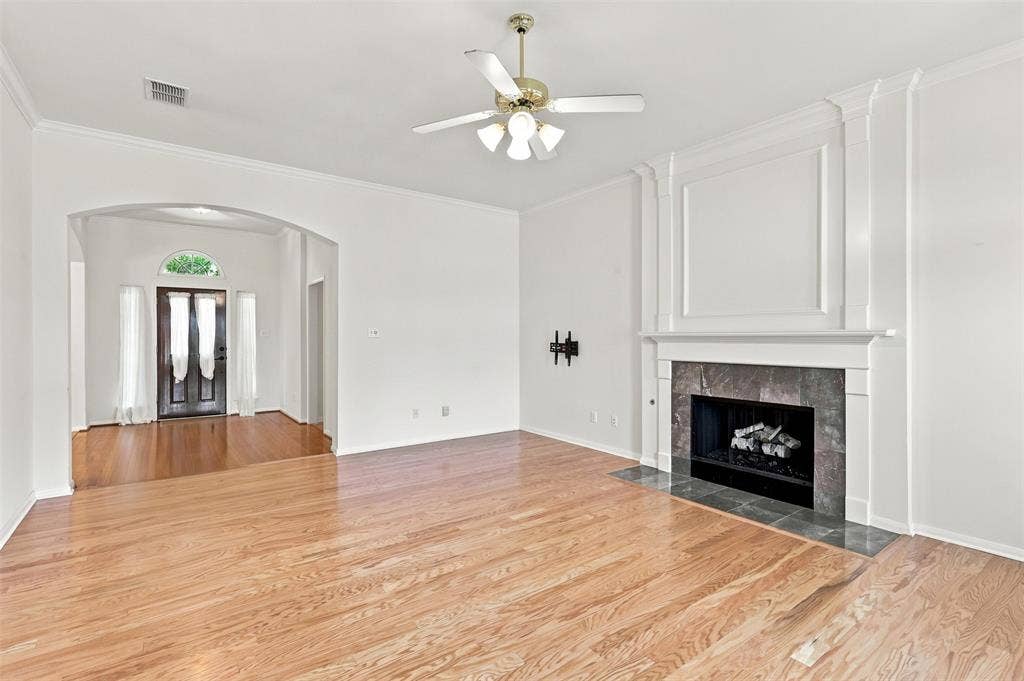 3617 Mackenzie Lane, Richardson, TX 75082 Living Room features engineered hardwood floors and gas fireplace.