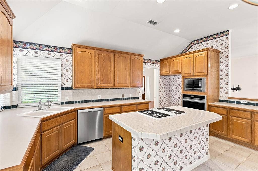 3617 Mackenzie Lane, Richardson, TX 75082 Plenty of counter space for meal prep and island allows for bar stools for early morning breakfast.