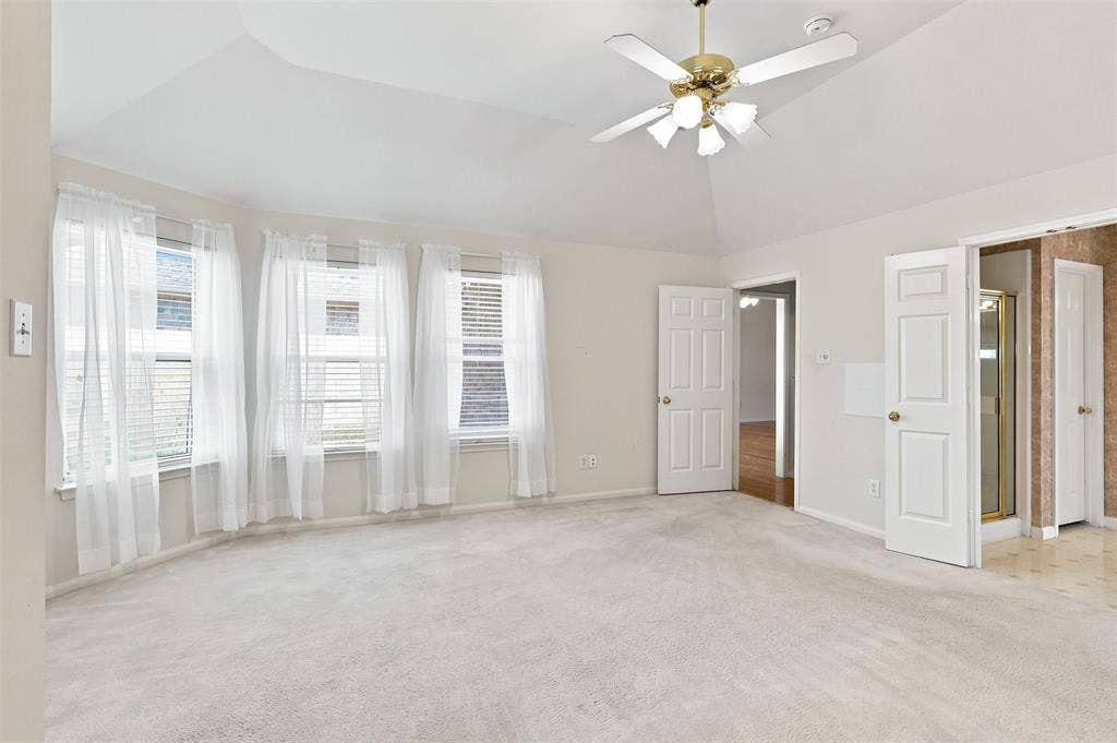 3617 Mackenzie Lane, Richardson, TX 75082 Primary bedroom looking towards windows and en-suite bathroom.