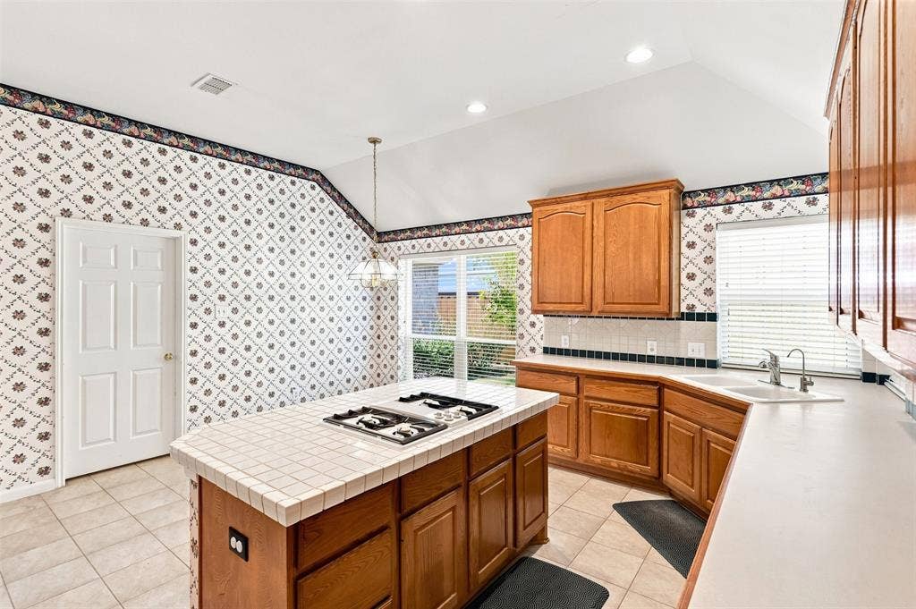 3617 Mackenzie Lane, Richardson, TX 75082 Island looks towards eat-in kitchen area for easy conversation during meal prep.