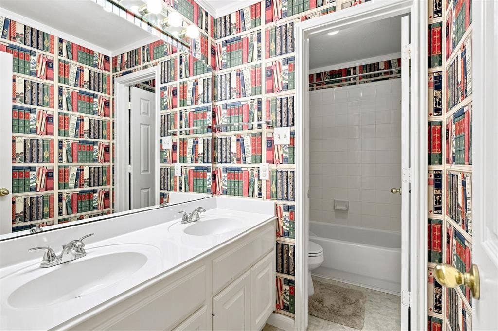 3617 Mackenzie Lane, Richardson, TX 75082 Secondary bathroom with dual sinks and private toilet and shower/tub combo.