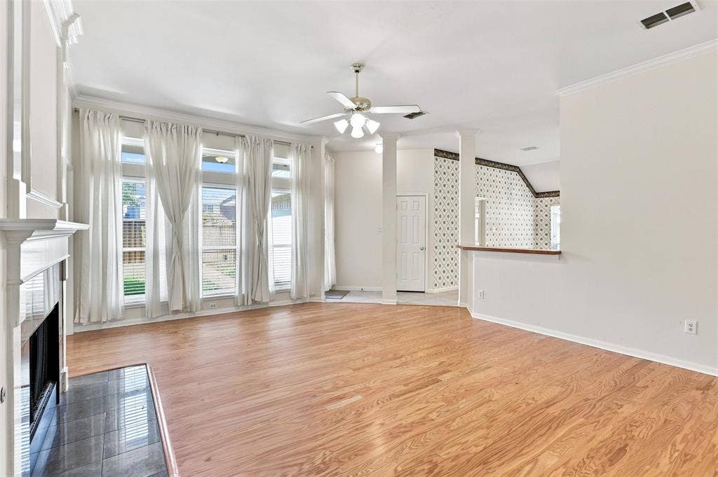 3617 Mackenzie Lane, Richardson, TX 75082 Wall of windows in living room look to backyard and allow for lots of natural light.