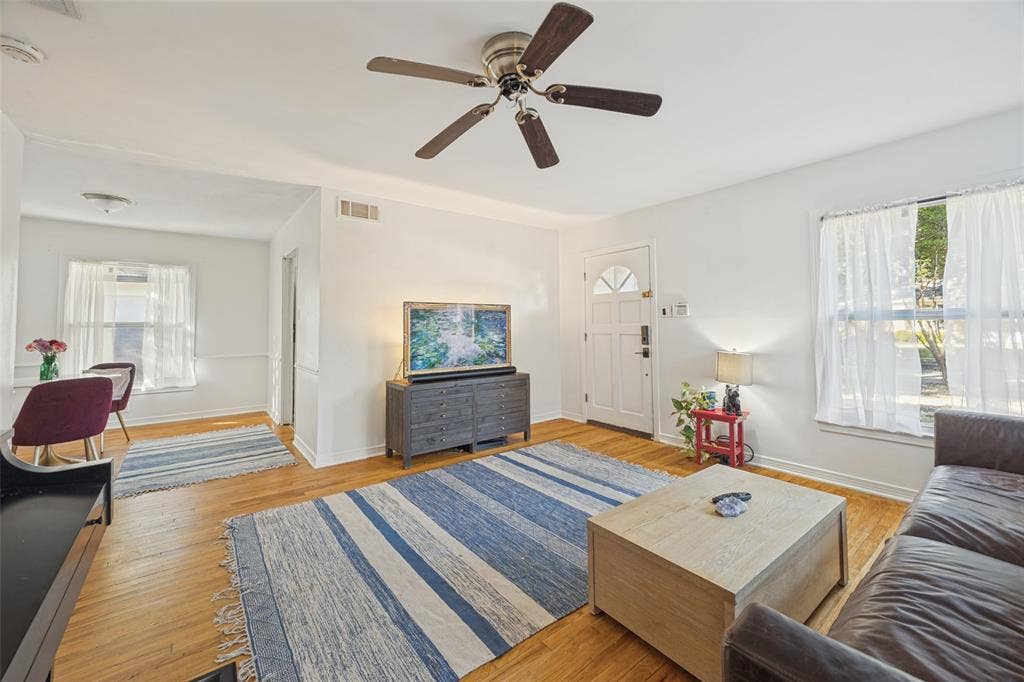 559 Blanning Drive, Dallas, TX 75218 Hard wood flooring throughout, freshly painted white interior walls, and a ceiling fan with integrated lighting