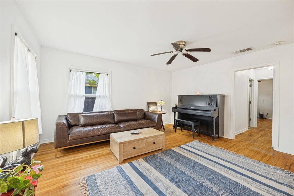 559 Blanning Drive, Dallas, TX 75218 Hardwood flooring, freshly painted walls, ceiling fan, and window with natural light