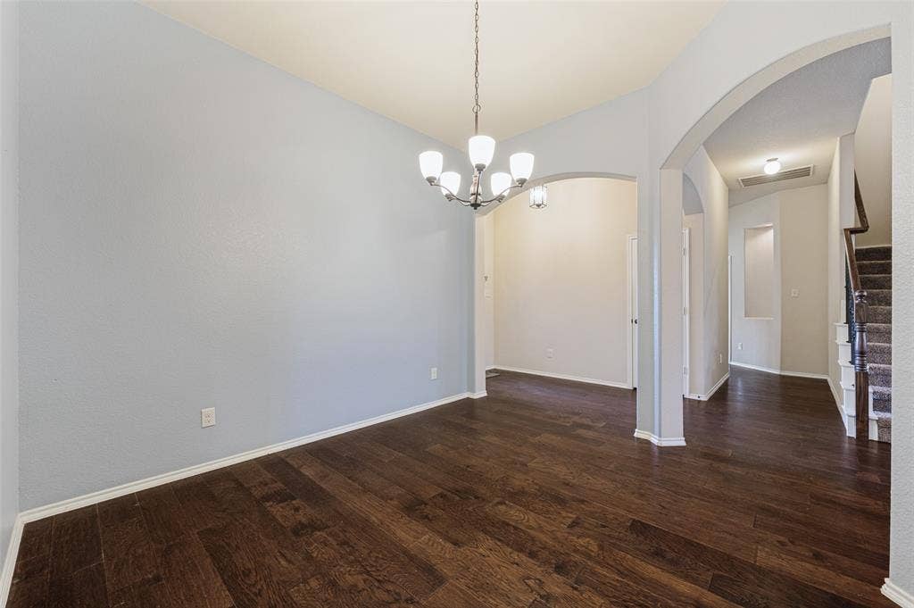 Rich wood-finish flooring complemented by light-toned walls