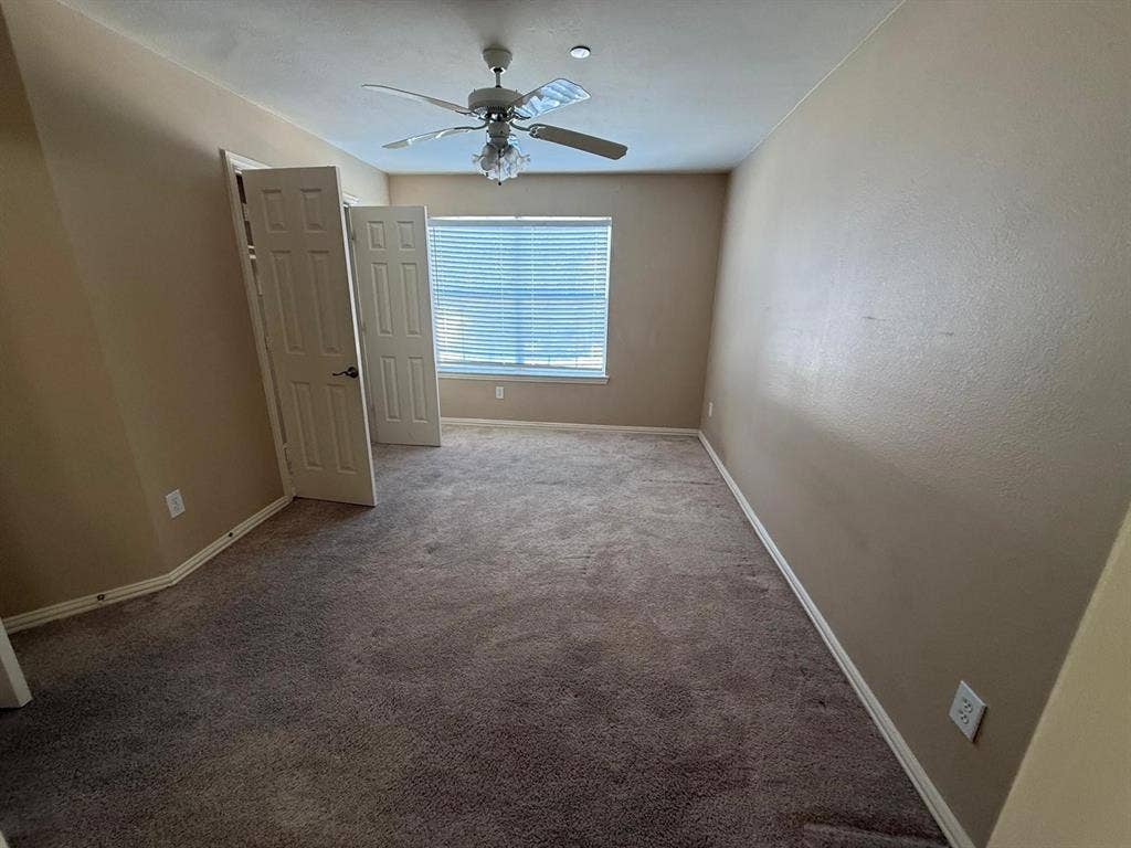10012 Castlewood Drive, Plano, TX 75025 Recessed window with blinds, ceiling fan with light fixture, and textured walls