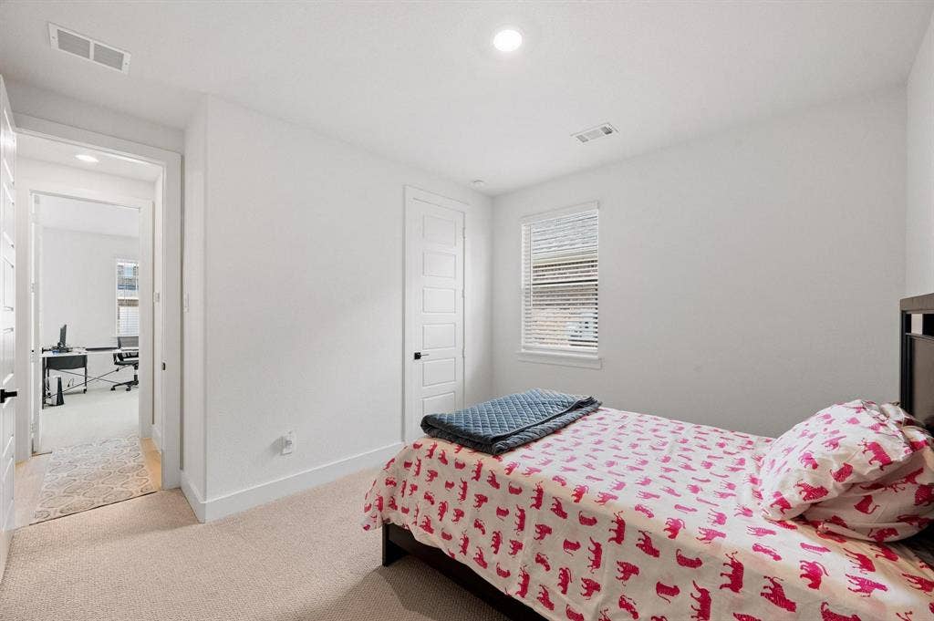 Recessed lighting, wall-to-wall carpeting, and five-panel interior door