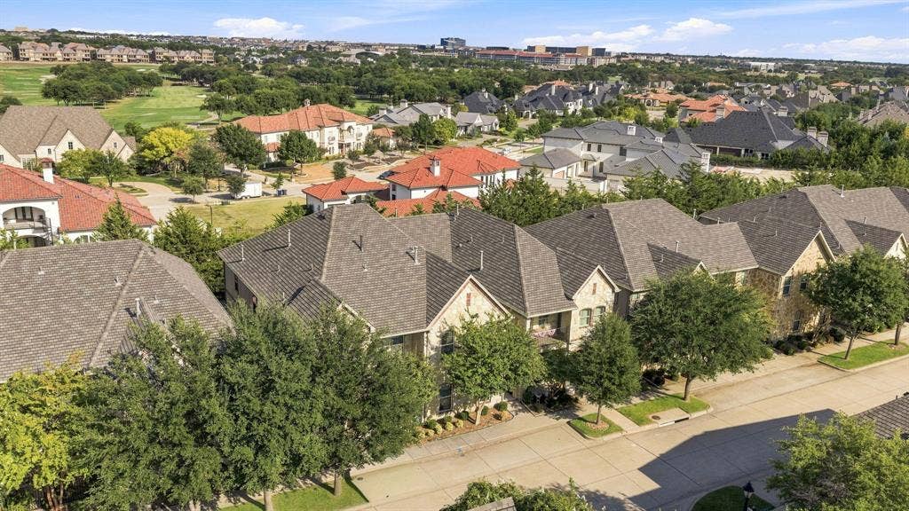 5605 Cojimar Drive, McKinney, TX 75070 Residential community featuring mature trees, a street, and varied architectural styles