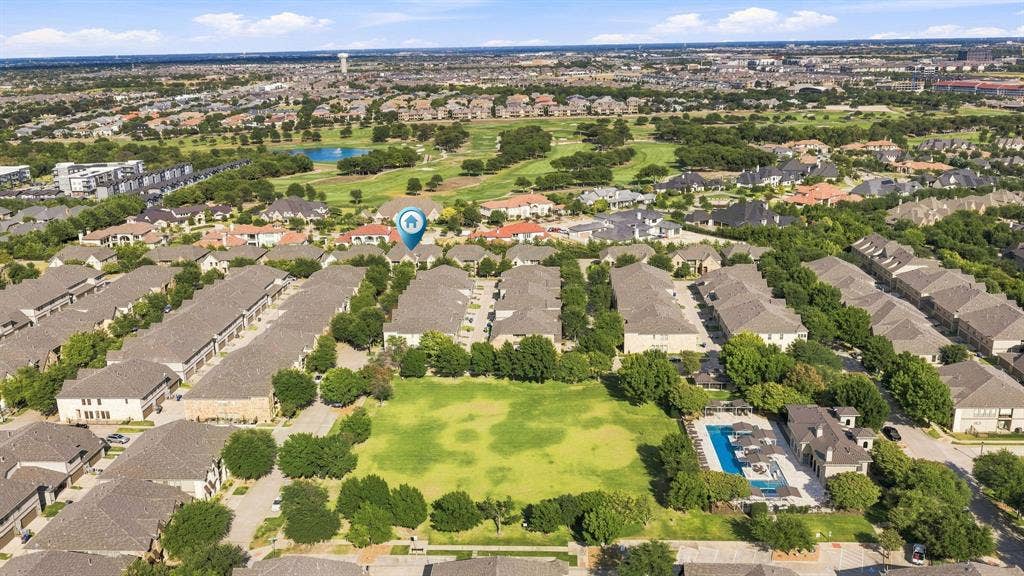 5605 Cojimar Drive, McKinney, TX 75070 Community pool with surrounding lounge areas, expansive green space, and golf course access