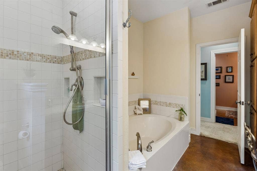 3227 Berry Hollow, Melissa, TX 75454 Alcove soaking tub, walk-in shower with tile surround and glass enclosure, tiled shower niche, and mosaic tile accent band