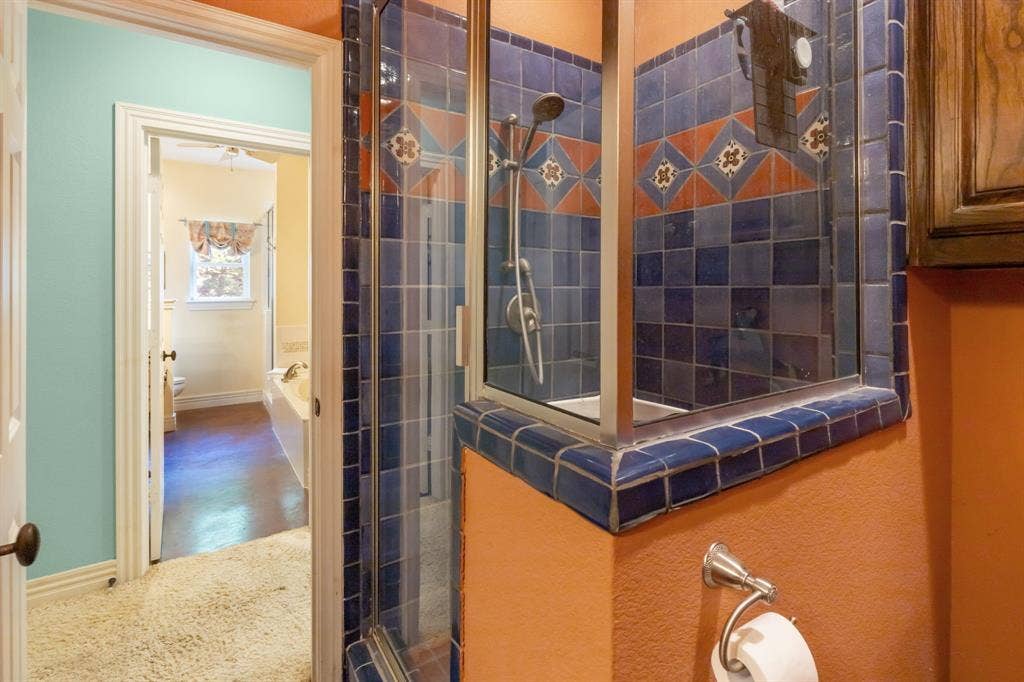 3227 Berry Hollow, Melissa, TX 75454 Shower enclosure featuring blue and orange patterned tile
