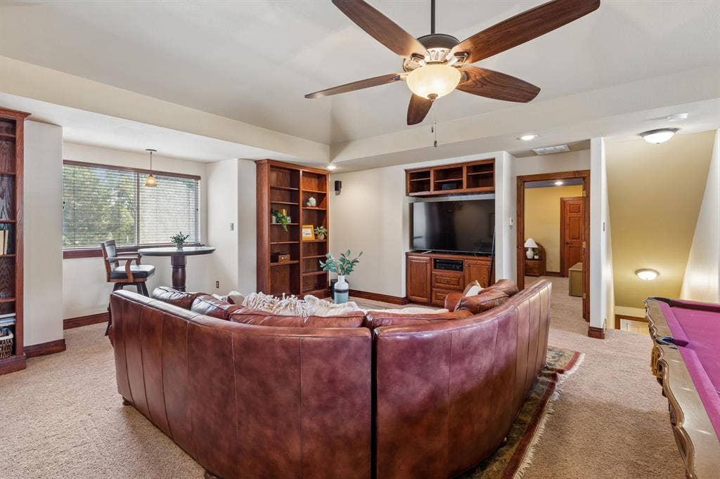 3227 Berry Hollow, Melissa, TX 75454 Recessed lighting, wood-finish ceiling fan, built-in media center, built-in shelving, and carpeted flooring