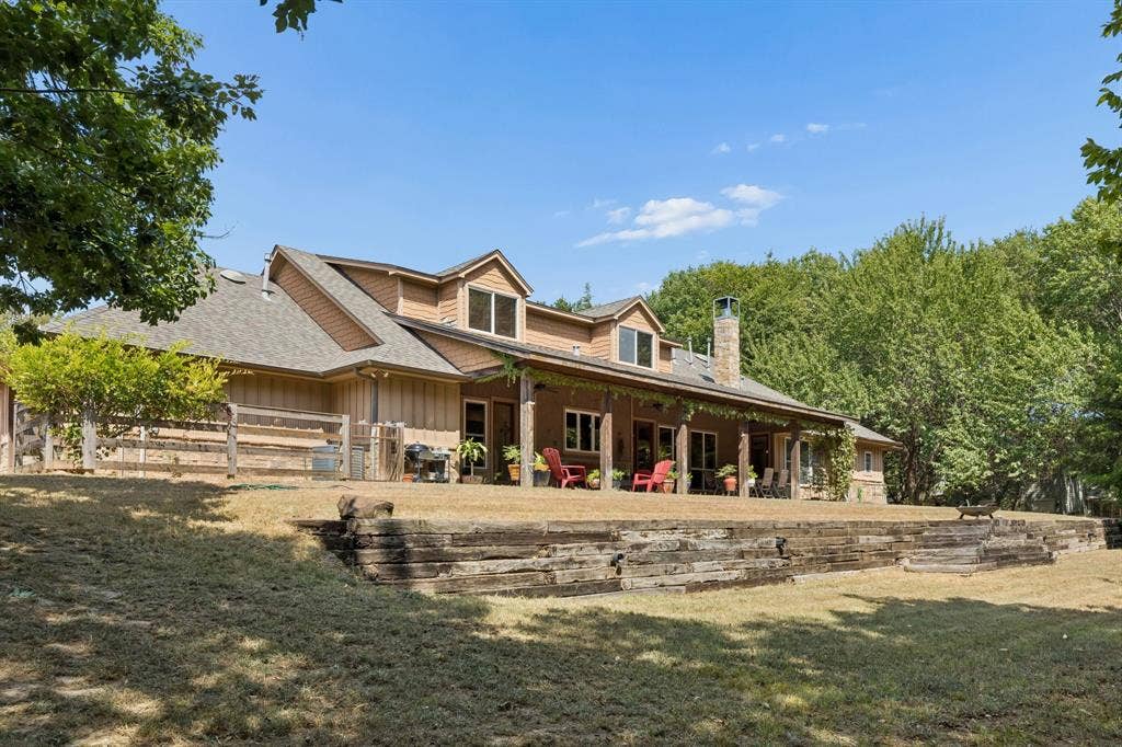 3227 Berry Hollow, Melissa, TX 75454 Enjoy a relaxing cup of coffee on the expansive covered patio overlooking plenty of trees
