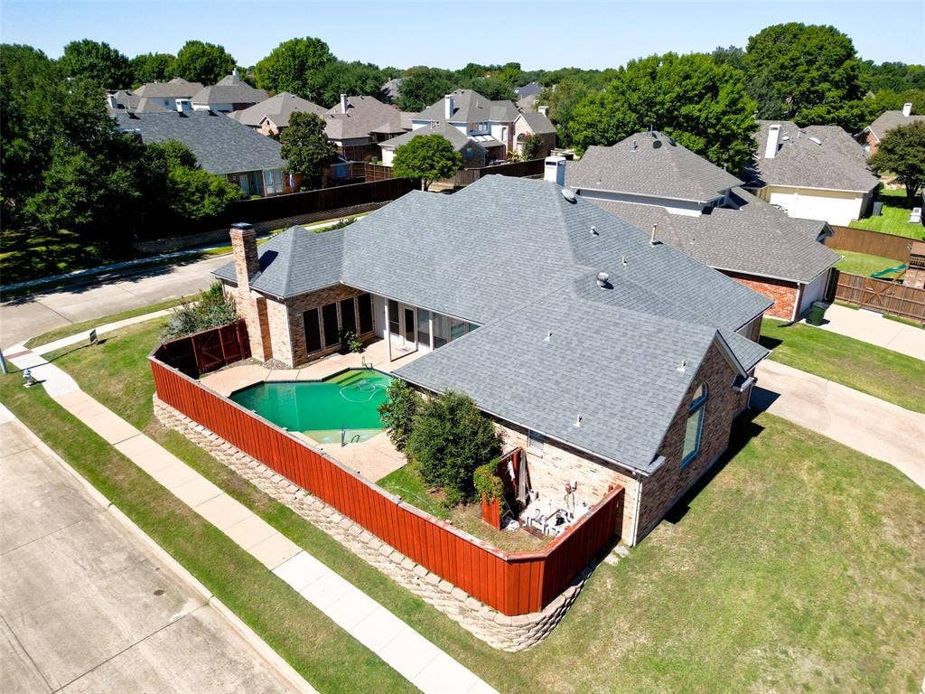 Brick exterior with a gray shingle roof