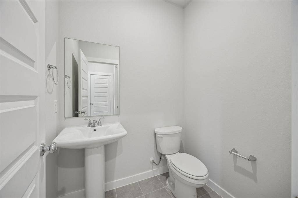 2709 Delevan Drive, Princeton, TX 75407 Bathroom in the Oak II home plan by Trophy Signature Homes – REPRESENTATIVE PHOTO