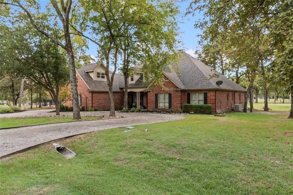 Front of home with circle driveway