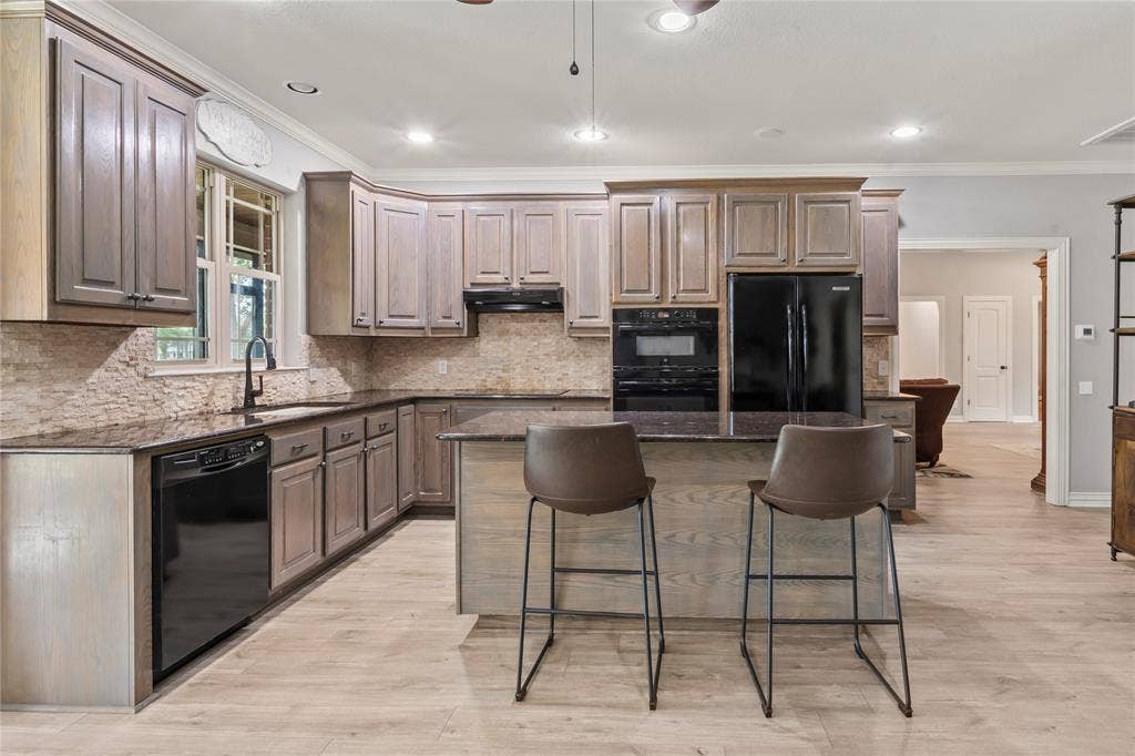 Kitchen with island and bar seating
