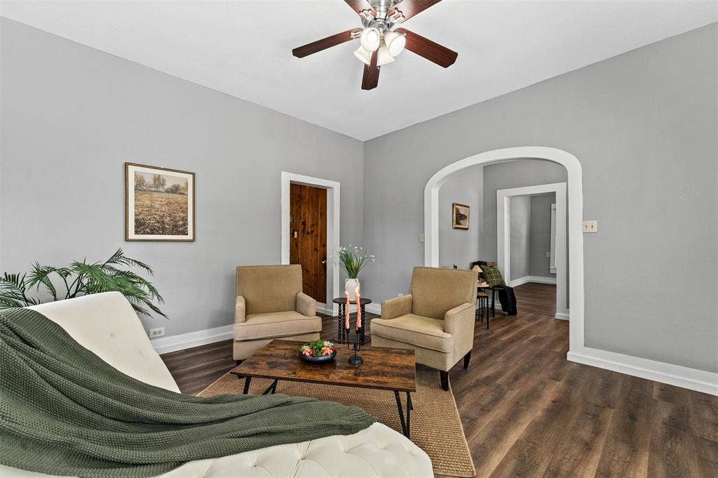 302 W Broadway Street, West, TX 76691 Archway entry, wood-finish flooring, ceiling fan, white trim, and wood door
