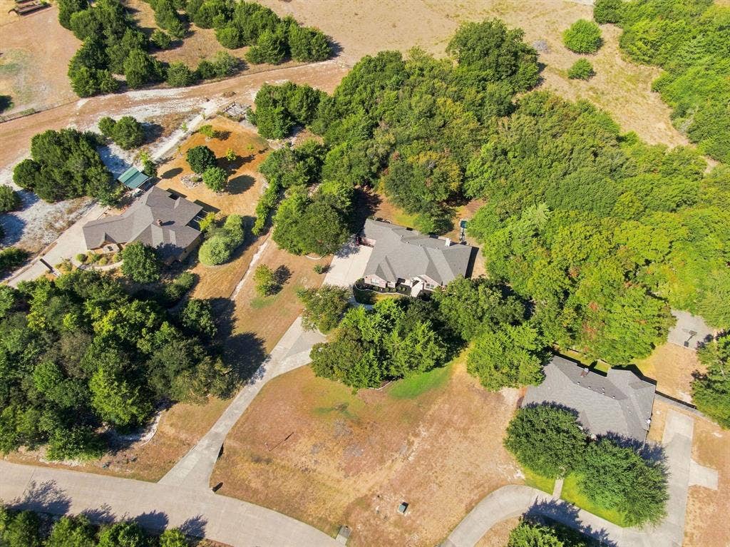 Extensive treed lot with a private driveway, offering exceptional privacy and natural beauty.