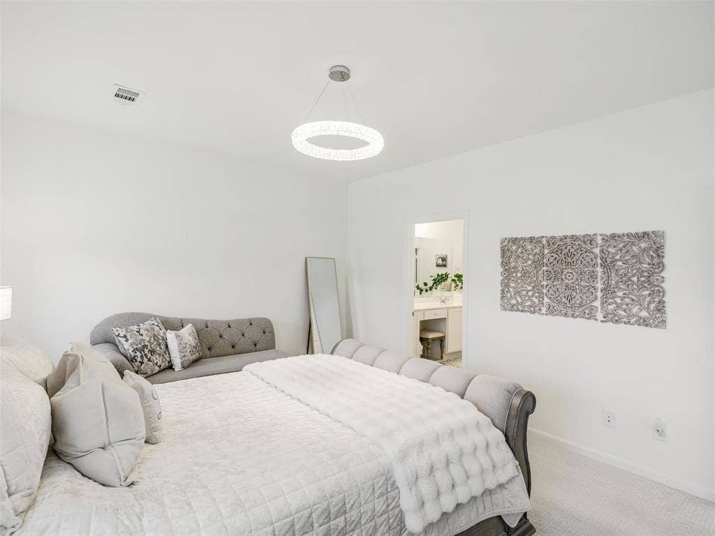 Recessed ceiling lighting, modern circular chandelier, plush carpeting