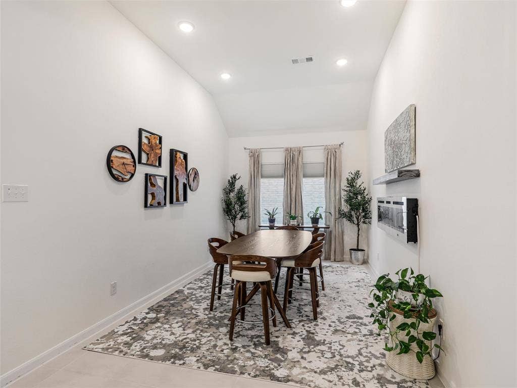 Vaulted ceilings and recessed lighting illuminate the interior