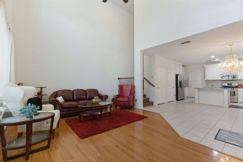524 S Greenville Avenue, Richardson, TX 75081 The living room features high ceilings and large windows that provide abundant natural light and an airy, spacious atmosphere.