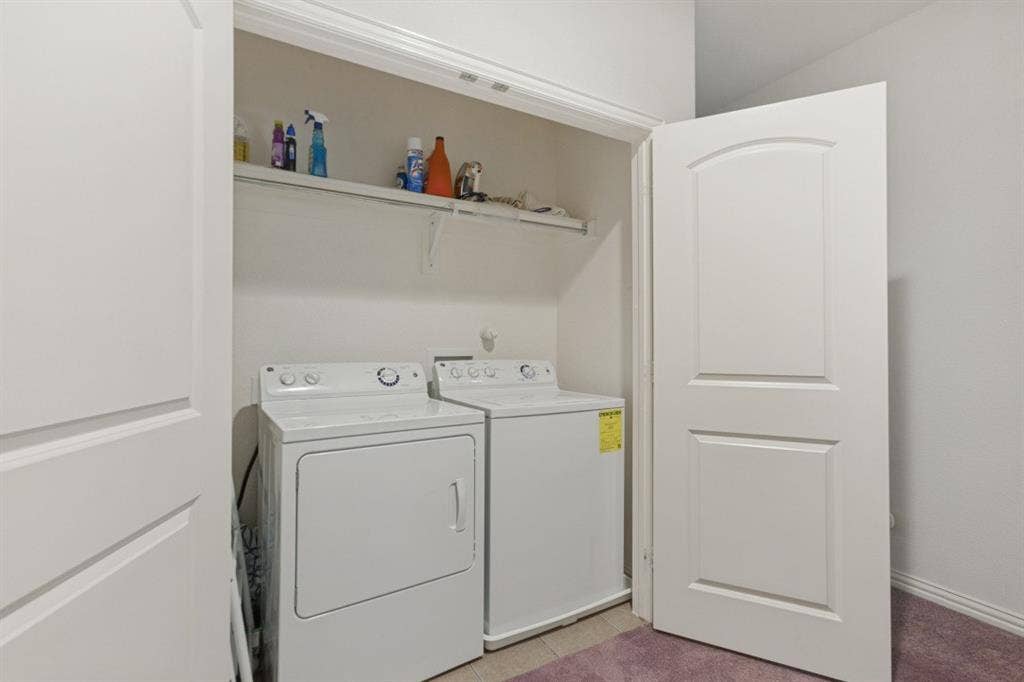 524 S Greenville Avenue, Richardson, TX 75081 Dedicated laundry closet with built-in shelving, providing functional utility