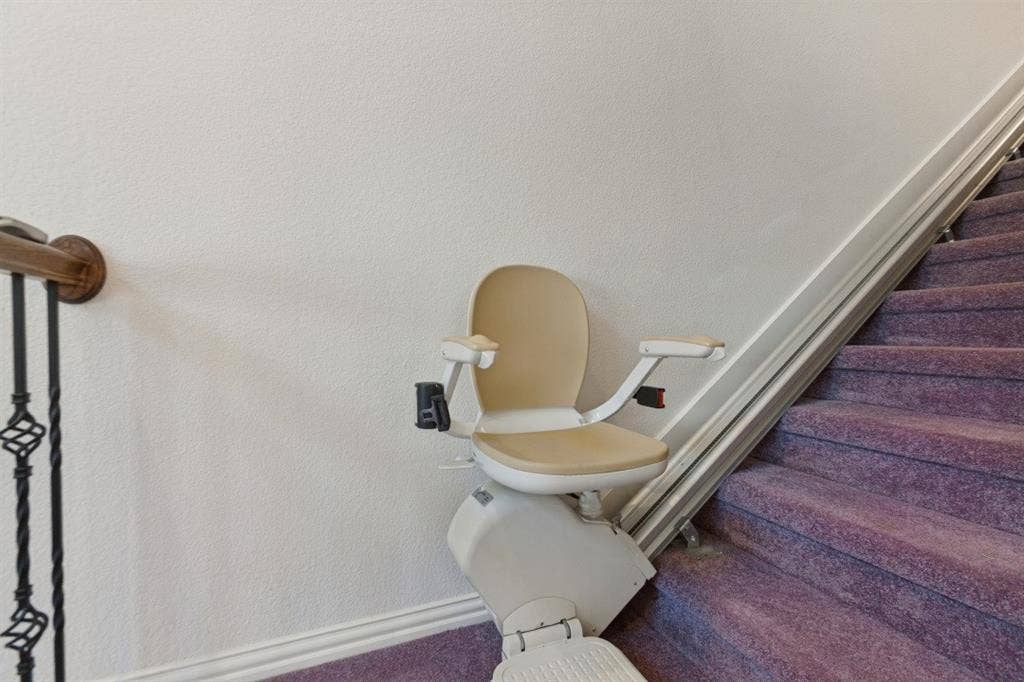 524 S Greenville Avenue, Richardson, TX 75081 Stair lift installed at the base of stairs for enhanced accessibility.