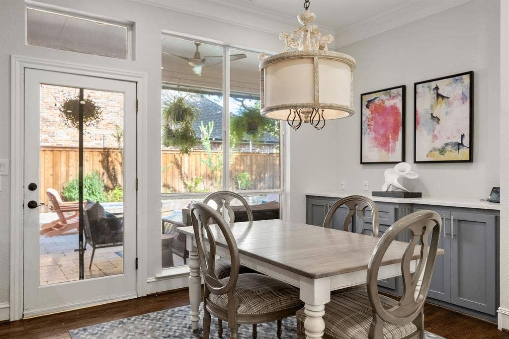 5748 Clarendon Drive, Plano, TX 75093 Pristine breakfast room with custom cabinetry, decorative lighting & views of the backyard oasis.