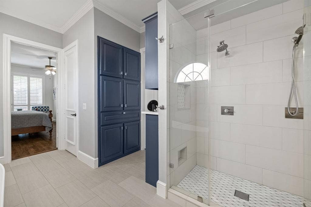 5748 Clarendon Drive, Plano, TX 75093 Additional storage in custom cabinetry leading to an extended walk-in closet with built-ins.