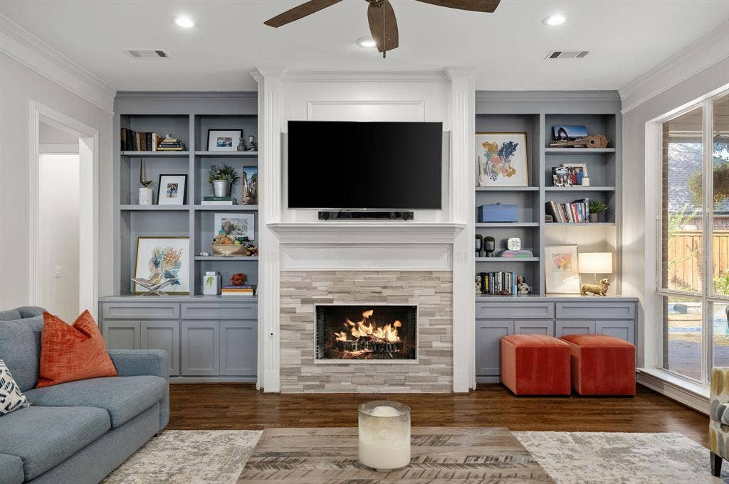 5748 Clarendon Drive, Plano, TX 75093 This gorgeous remodeled fireplace is flanked by custom cabinetry.