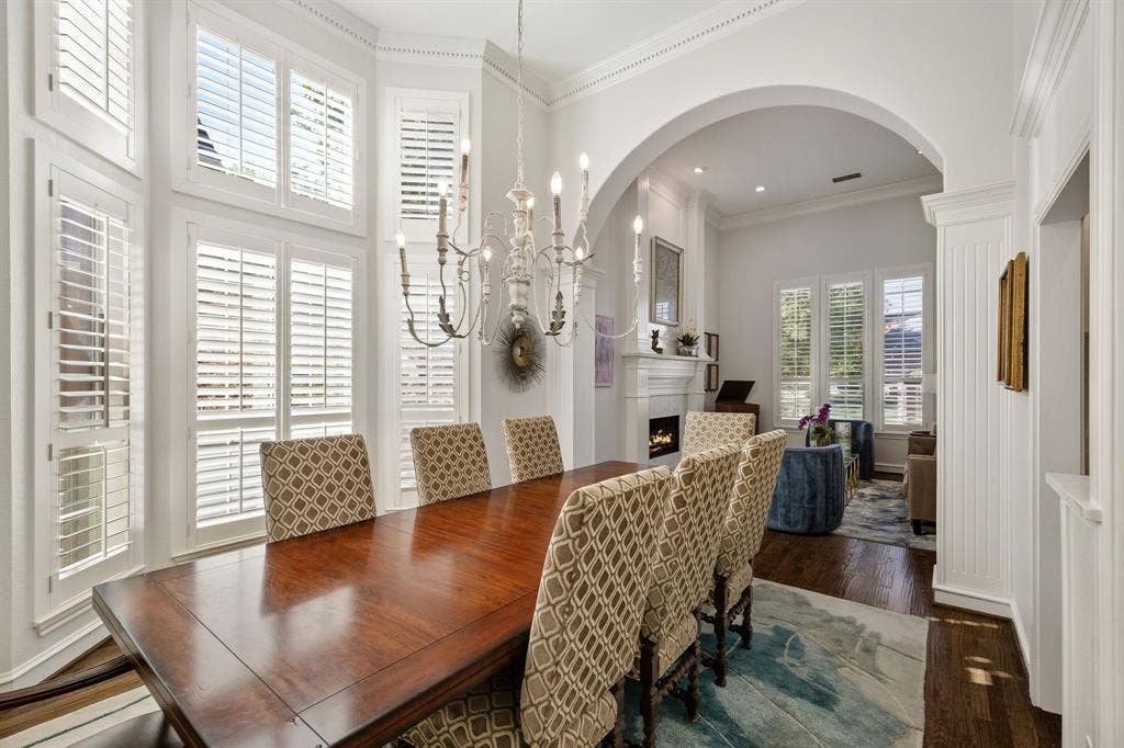 5748 Clarendon Drive, Plano, TX 75093 Designer chandelier, plantation shutters, access to the kitchen & wet bar.