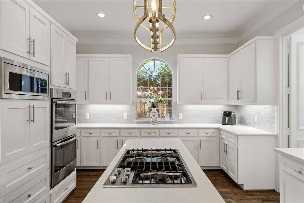 5748 Clarendon Drive, Plano, TX 75093 Spacious island with Jenn-Air gas cooktop.