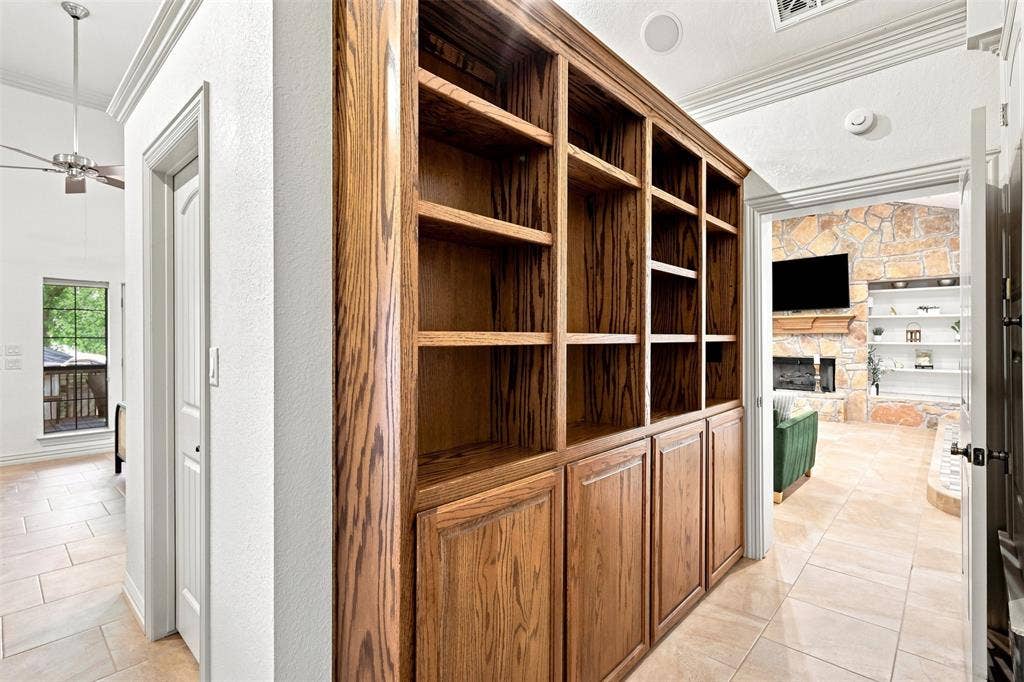 284 Shoreline Drive N, Azle, TX 76020 Built-in wood-finish cabinetry with open shelving and closed storage