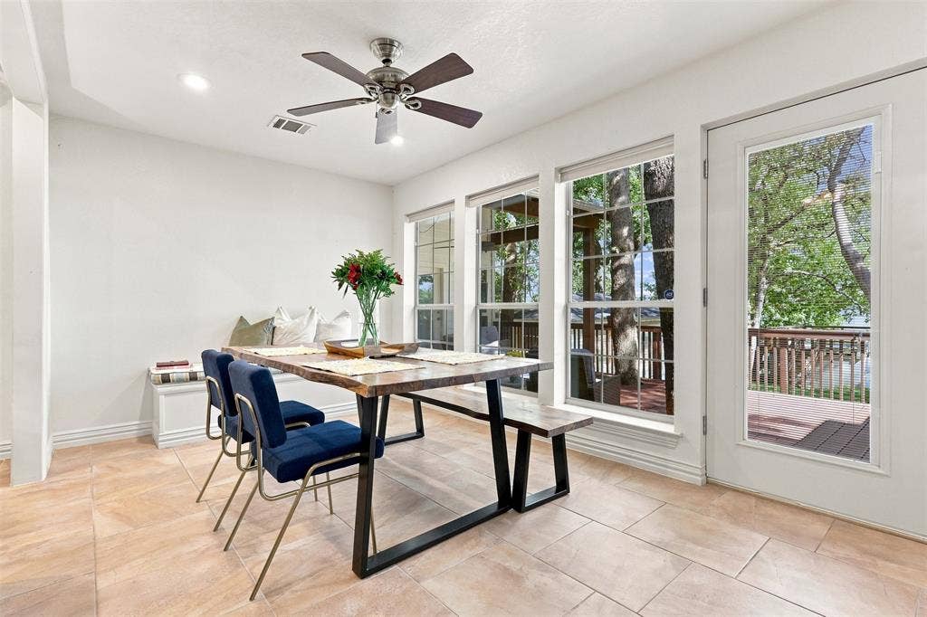 284 Shoreline Drive N, Azle, TX 76020 Recessed lighting, ceiling fan, built-in window seating, tile flooring, and glass-paneled door to deck