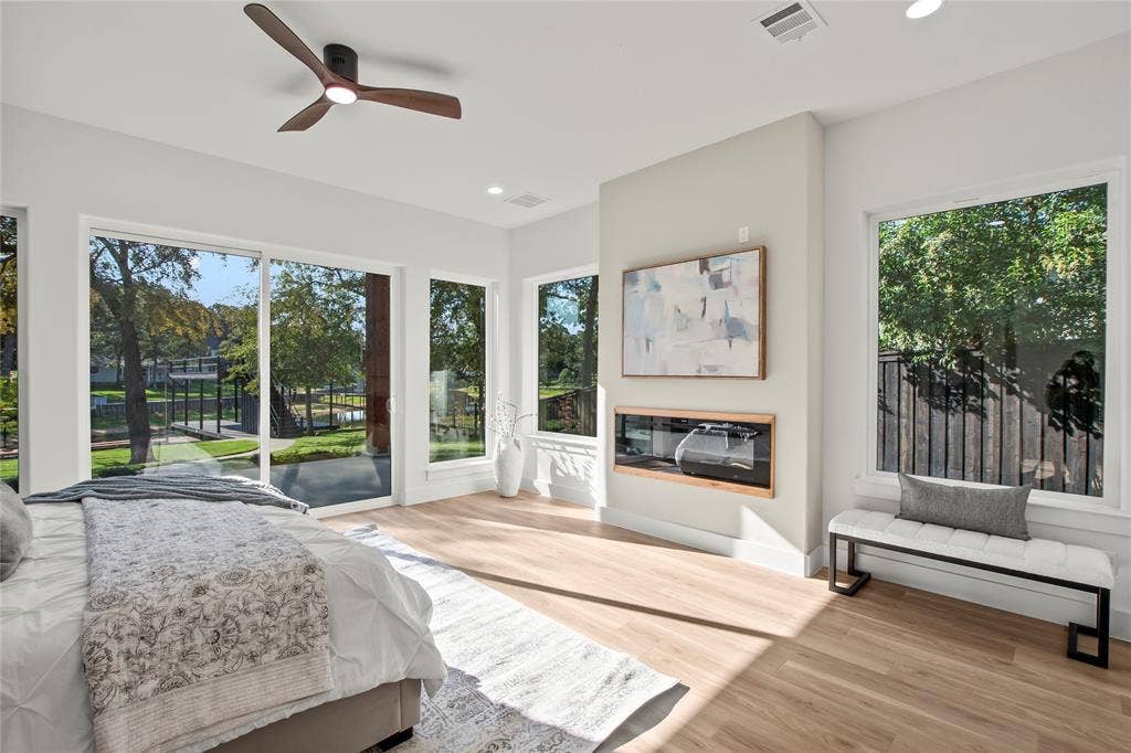 625 Turner Drive, Trinidad, TX 75163 Waterside primary suite (Bedroom #1) with access to patio, and electrical fireplace. Level one