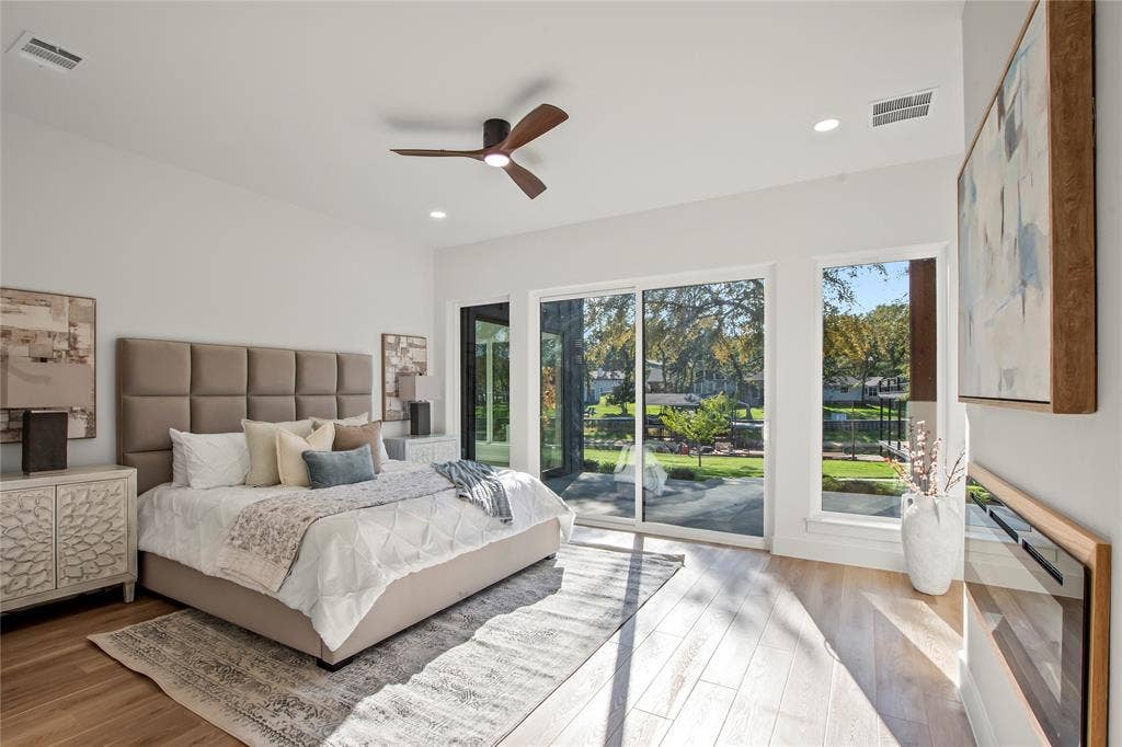 625 Turner Drive, Trinidad, TX 75163 Waterside primary suite (Bedroom #1) with access to patio, and electrical fireplace. Level one