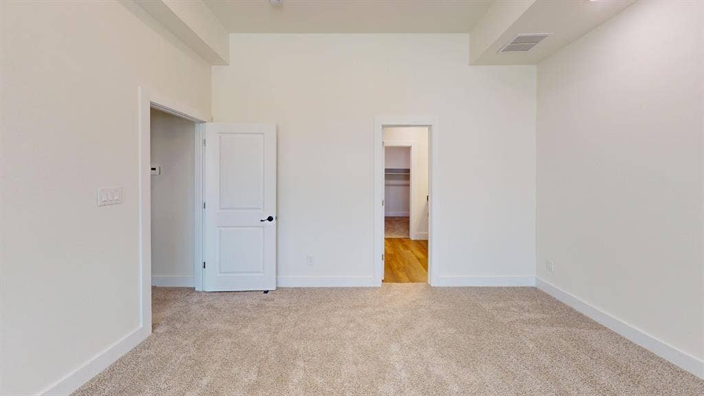373 Buck Ridge Drive, Frisco, TX 75068 Bright interior space featuring neutral carpeting, white walls, and a recessed ceiling element
