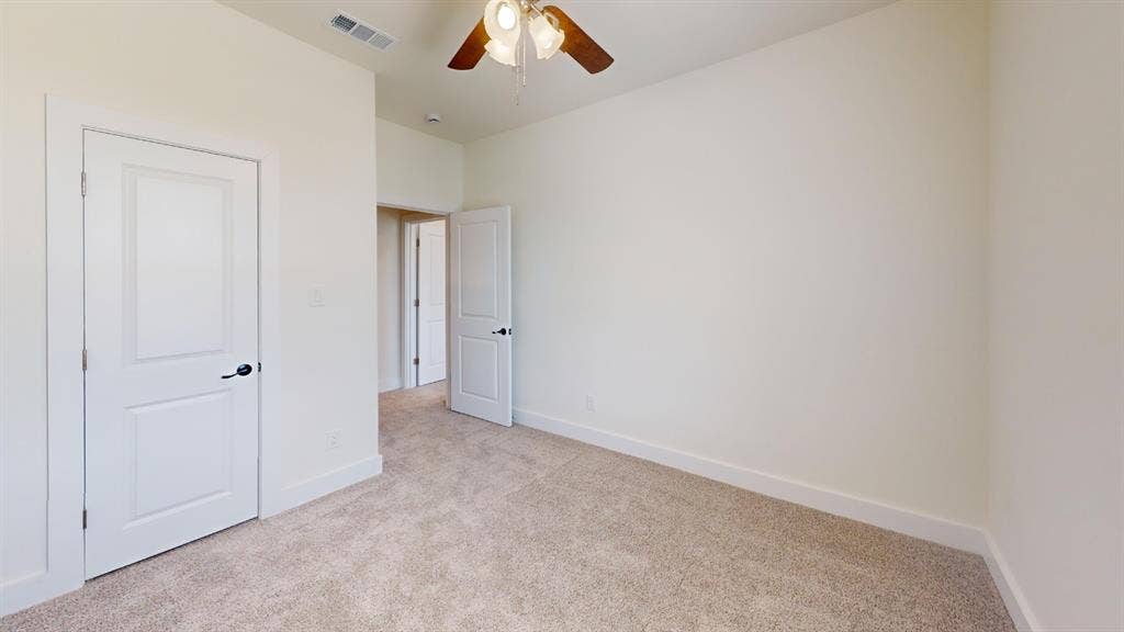 373 Buck Ridge Drive, Frisco, TX 75068 Neutral-toned carpeting with white trim