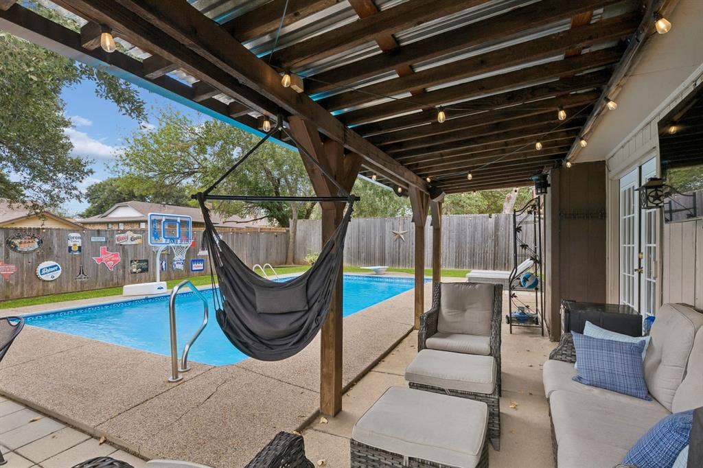 6512 Highview Terrace, Watauga, TX 76148 Covered patio with accent lighting (conveys) and view of sparking pool