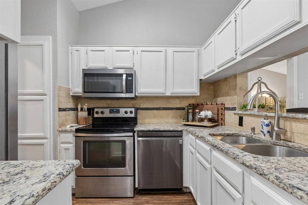 6512 Highview Terrace, Watauga, TX 76148 Kitchen with fresh paint and stainless steel appliances