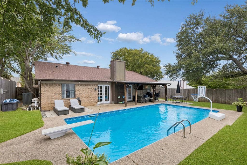 6512 Highview Terrace, Watauga, TX 76148 Pool with view of home and covered patio