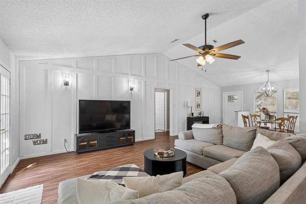 6512 Highview Terrace, Watauga, TX 76148 Living room with view of new accent wall and wall sconces
