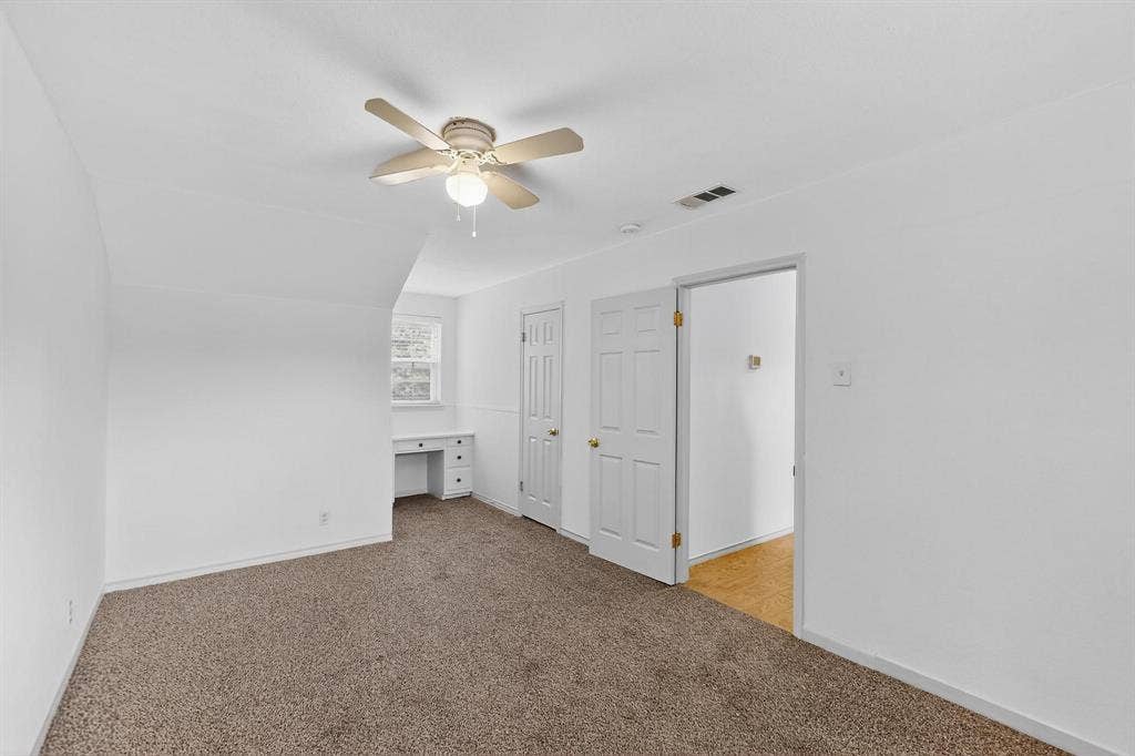 2927 Selma Lane, Farmers Branch, TX 75234 Bonus room featuring light colored carpet and ceiling fan