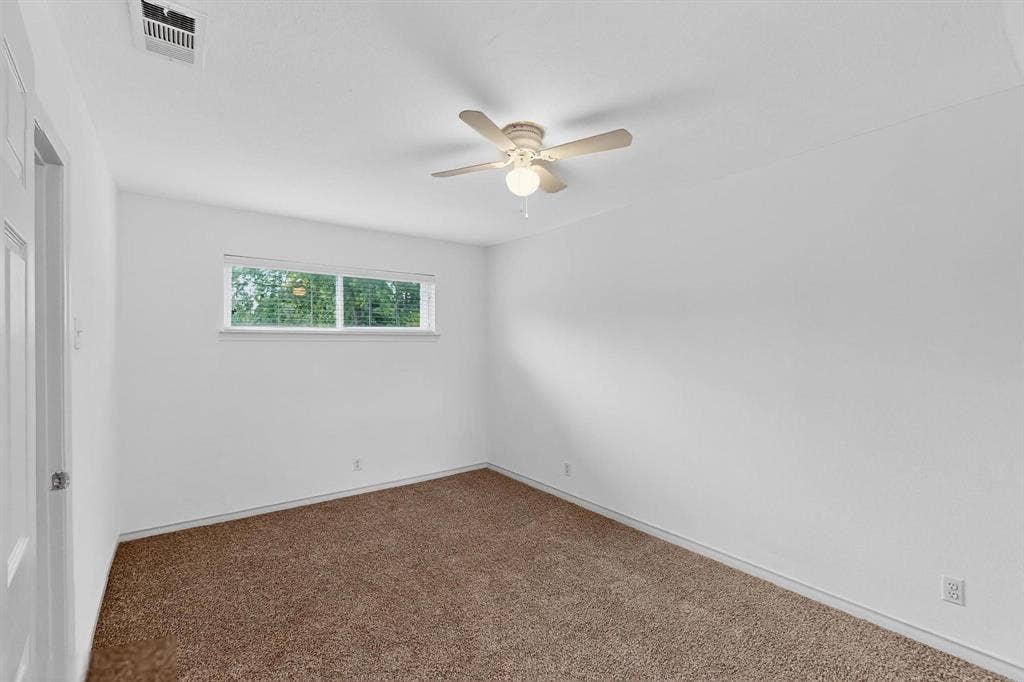 2927 Selma Lane, Farmers Branch, TX 75234 Unfurnished room with a ceiling fan and carpet floors