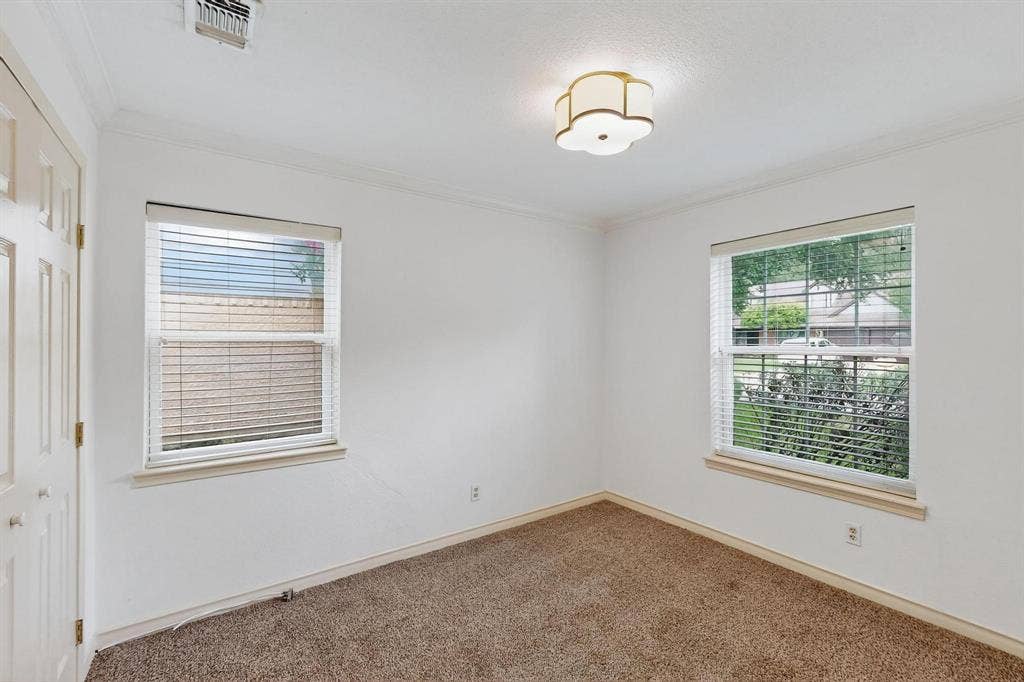 2927 Selma Lane, Farmers Branch, TX 75234 Carpeted spare room with crown molding