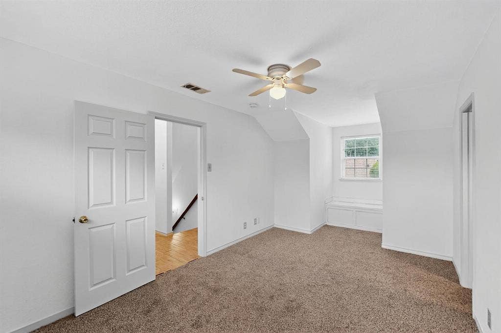 2927 Selma Lane, Farmers Branch, TX 75234 Additional living space featuring light colored carpet, a ceiling fan, and lofted ceiling