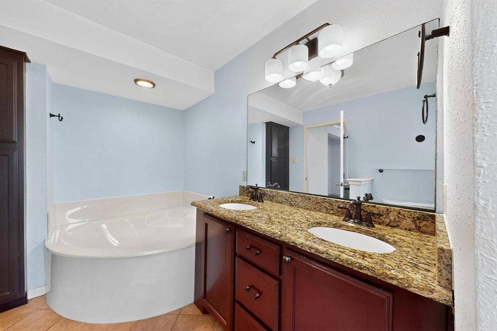 2927 Selma Lane, Farmers Branch, TX 75234 Full bathroom with a bath, double vanity, and tile patterned floors
